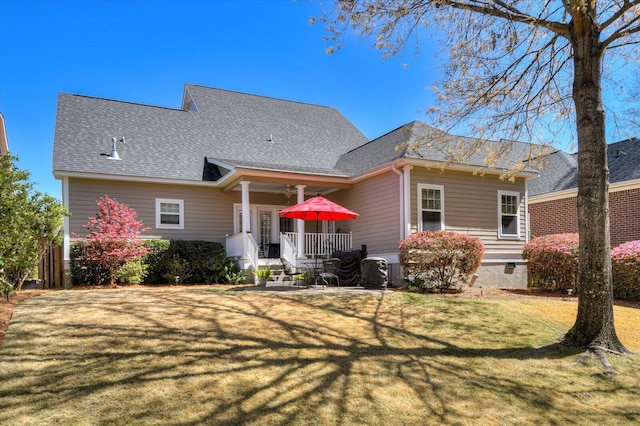 909 Nerium Trl, Evans, GA 30809 - back of house featuring a shingled roof and a yard