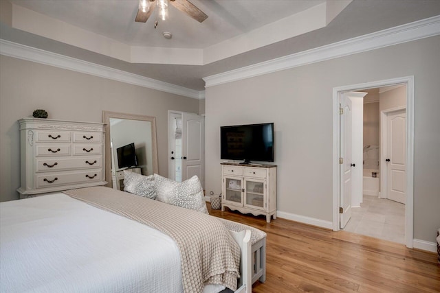 909 Nerium Trl, Evans, GA 30809 - bedroom featuring baseboards, ornamental molding, a tray ceiling, and light wood finished floors