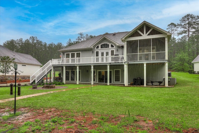 107 Stonebridge Loop, Mccormick, SC 29835 - rear view of house featuring a sunroom, a deck, a yard, roof with shingles, and stairs