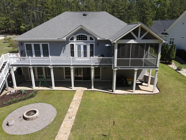 107 Stonebridge Loop, Mccormick, SC 29835 - back of house featuring an outdoor fire pit, a patio, a shingled roof, and a lawn