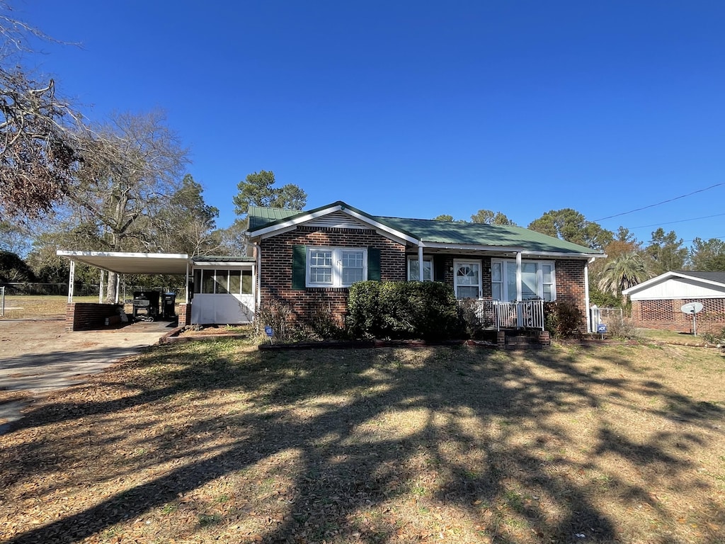 view of front of house with a carport