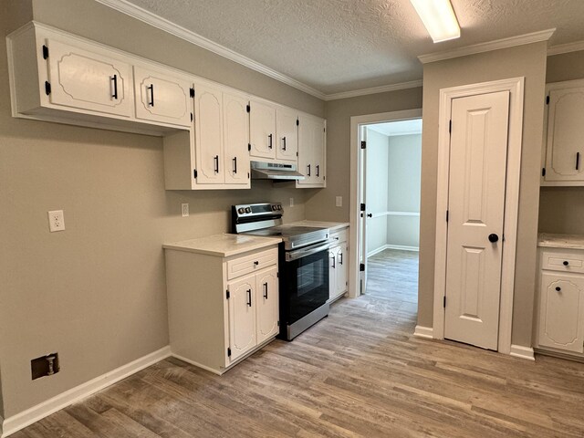 kitchen with white cabinetry, light hardwood / wood-style flooring, stainless steel range with electric cooktop, and a textured ceiling