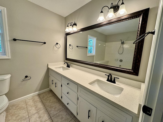 bathroom featuring tile patterned flooring, a shower, vanity, and toilet