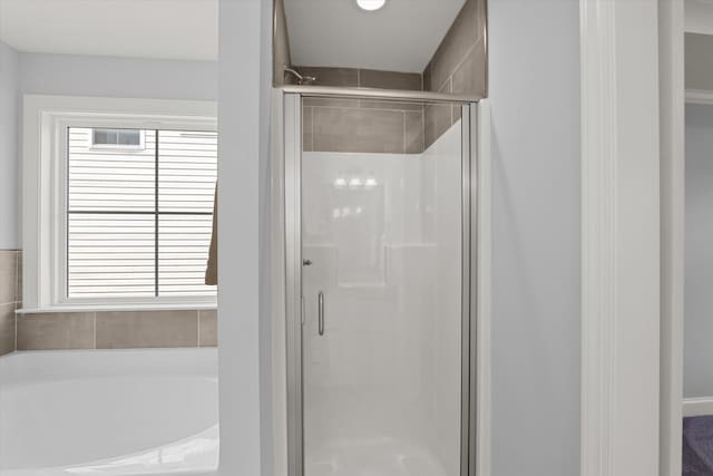 bathroom with independent shower and bath