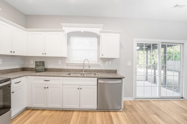 kitchen featuring white cabinets, light hardwood / wood-style floors, stainless steel dishwasher, and sink