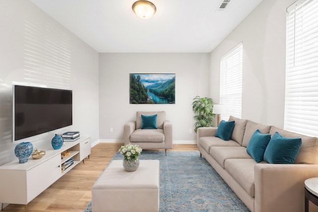 living room with light hardwood / wood-style flooring