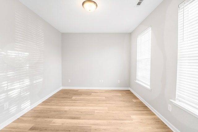 unfurnished room with light hardwood / wood-style flooring