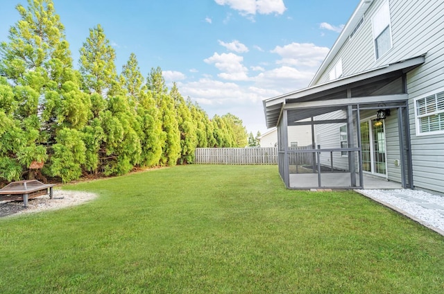 view of yard featuring a sunroom