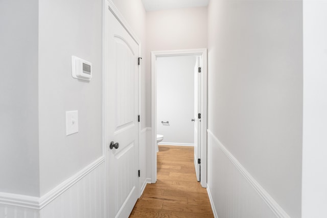 corridor with light wood-type flooring