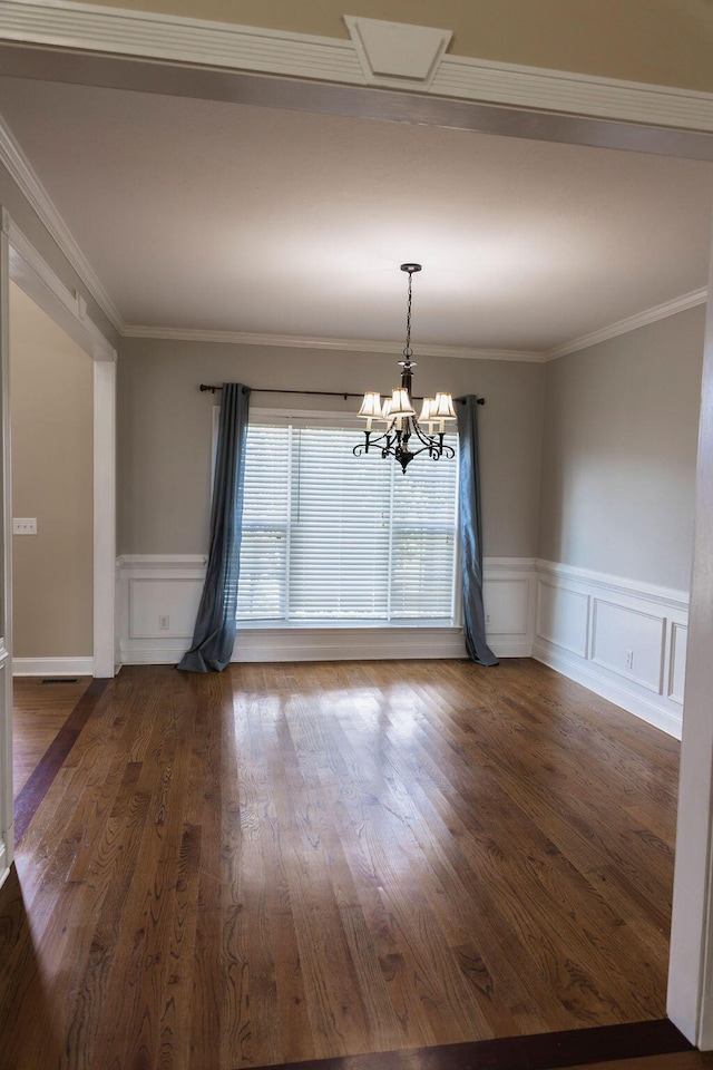 1212 Sumter Landing Ln, Evans, GA 30809 - unfurnished room with a chandelier, wainscoting, a decorative wall, wood finished floors, and crown molding