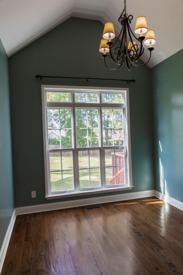 1212 Sumter Landing Ln, Evans, GA 30809 - empty room with lofted ceiling, a chandelier, and wood finished floors