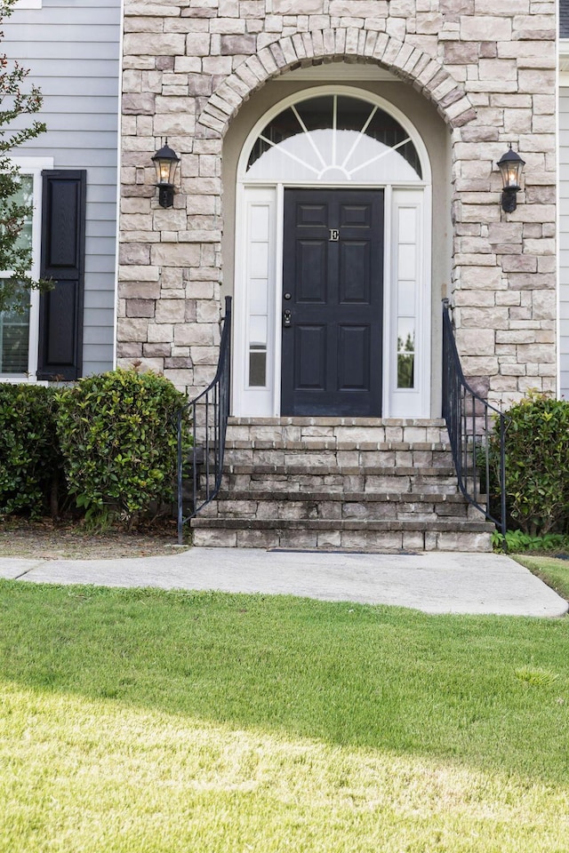 1212 Sumter Landing Ln, Evans, GA 30809 - doorway to property with stone siding and a yard