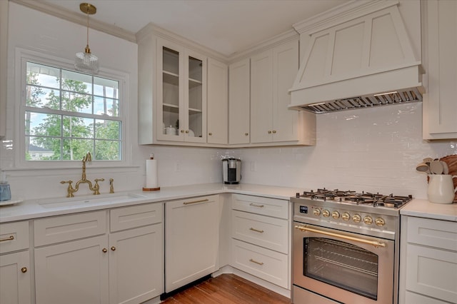 508 Scotts Way, Augusta, GA 30909 - kitchen featuring stainless steel stove, premium range hood, decorative backsplash, light countertops, and glass insert cabinets