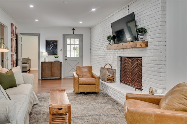508 Scotts Way, Augusta, GA 30909 - living room featuring brick wall, wood finished floors, a fireplace, and recessed lighting