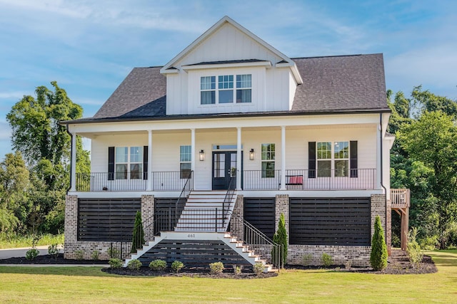 461 Rivernorth Dr, North Augusta, SC 29841 - view of front facade with stairway, a front yard, covered porch, and board and batten siding