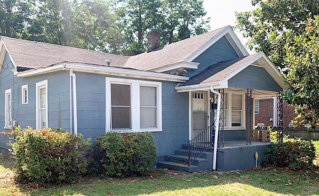 1424 Arsenal Ave, Augusta, GA 30904 - view of front of property featuring a chimney, a shingled roof, and a front yard