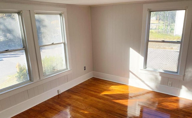 1424 Arsenal Ave, Augusta, GA 30904 - empty room featuring wood finished floors, healthy amount of natural light, and ornamental molding