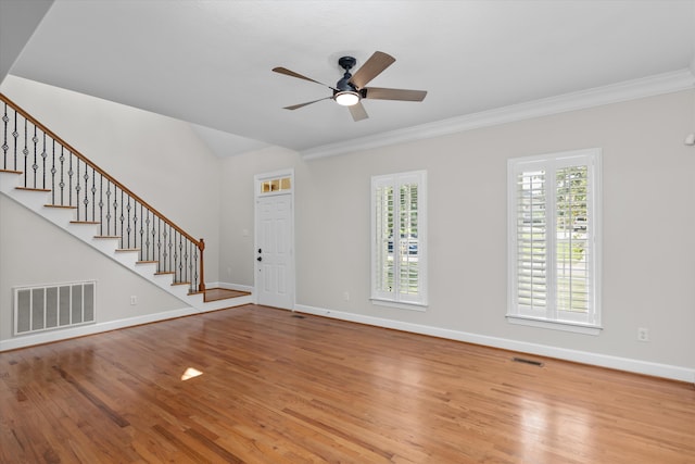 interior space featuring ceiling fan, light hardwood / wood-style floors, and crown molding