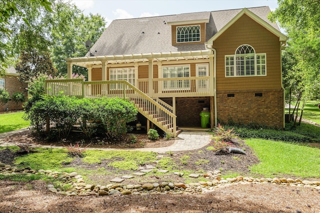 back of house with a wooden deck