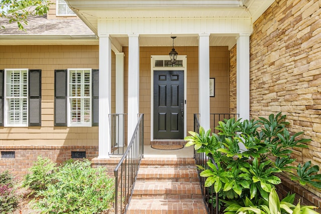 property entrance with covered porch