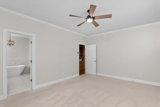 unfurnished bedroom featuring ensuite bathroom, crown molding, light colored carpet, and ceiling fan with notable chandelier