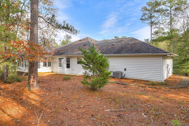 back of property with central AC