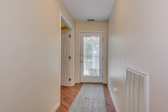 doorway with light hardwood / wood-style flooring