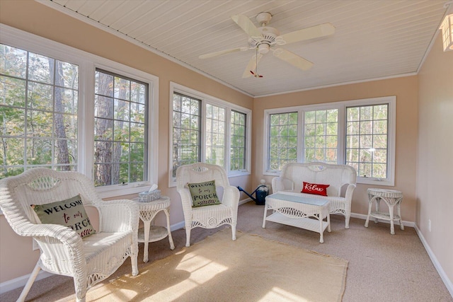 sunroom with plenty of natural light and ceiling fan