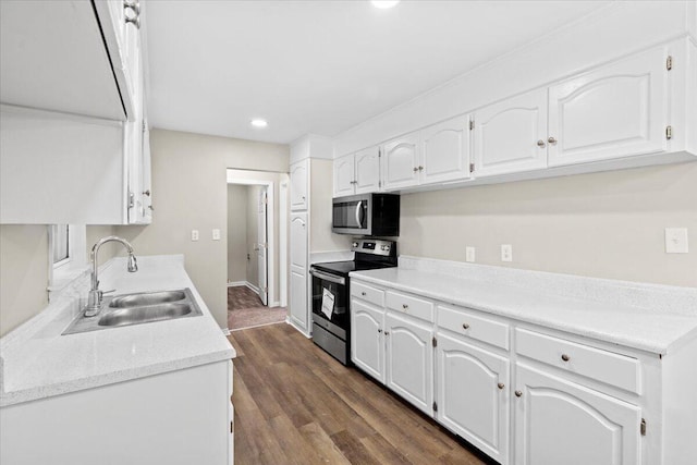 kitchen featuring sink, white cabinets, and stainless steel appliances