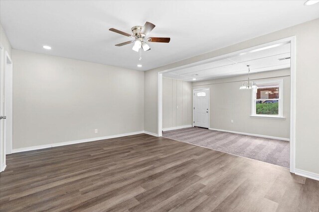 unfurnished room featuring ceiling fan and dark wood-type flooring