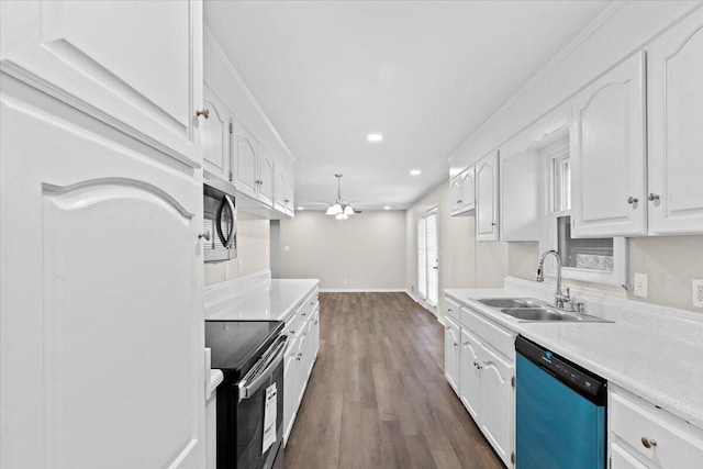 kitchen featuring white cabinetry, sink, ceiling fan, dark hardwood / wood-style floors, and appliances with stainless steel finishes