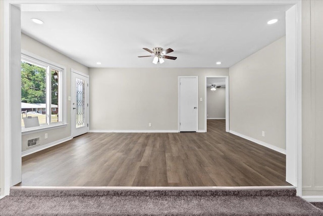 unfurnished room with dark hardwood / wood-style flooring