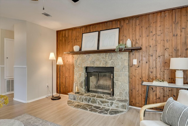 3204 Bel Ridge Rd, Augusta, GA 30909 - living room with wood finished floors, visible vents, wood walls, and baseboards