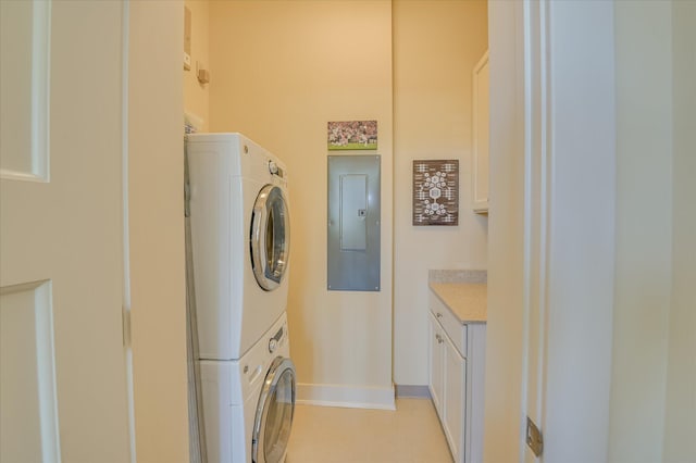 2349 Williams St, Augusta, GA 30904 - laundry room featuring stacked washer and clothes dryer, electric panel, and baseboards