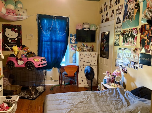 bedroom with wood finished floors