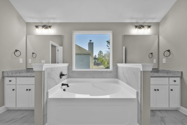 2767 Huntcliffe Dr, Augusta, GA 30909 - full bathroom with baseboards, marble finish floor, vanity, and a garden tub