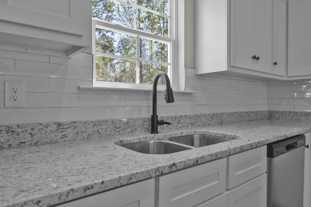 2767 Huntcliffe Dr, Augusta, GA 30909 - kitchen with a sink, tasteful backsplash, white cabinetry, and dishwasher