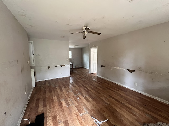 unfurnished room with ceiling fan and wood-type flooring