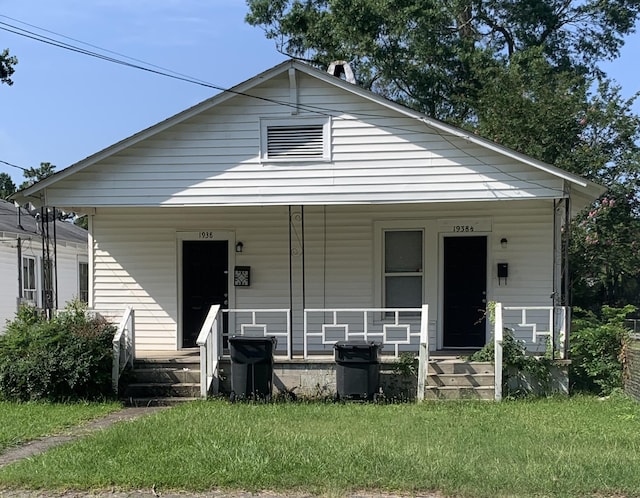 1938 Starnes St, Augusta, GA 30904 - view of front of home featuring covered porch and a front lawn