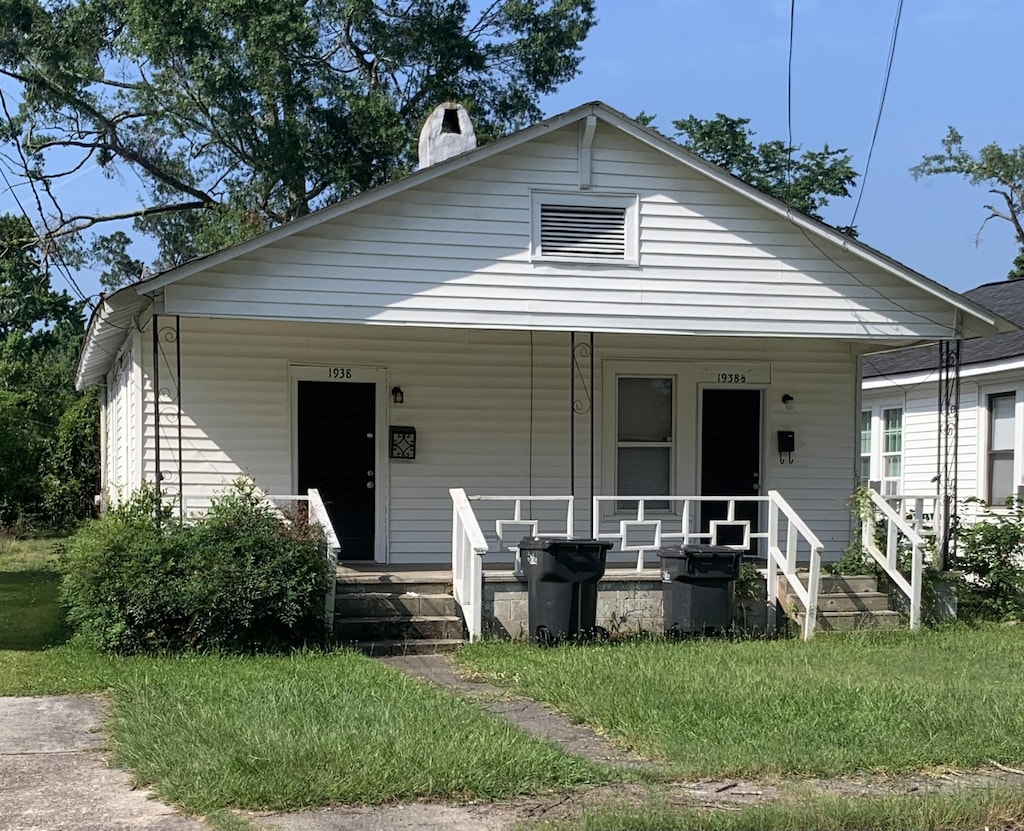 1938 Starnes St, Augusta, GA 30904 - bungalow featuring covered porch and a front lawn