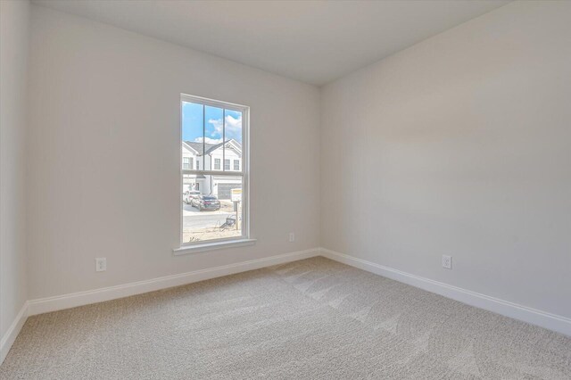 spare room with light hardwood / wood-style flooring and french doors