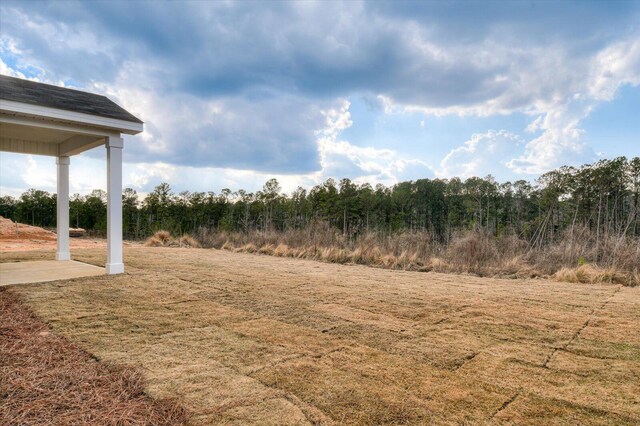 back of property featuring a lawn