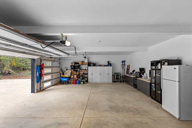 1008 Folly Run Dr, Lincolnton, GA 30817 - garage featuring freestanding refrigerator and a garage door opener