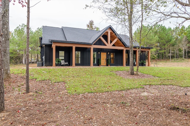 1008 Folly Run Dr, Lincolnton, GA 30817 - view of front of home featuring a front yard, board and batten siding, a porch, and roof with shingles