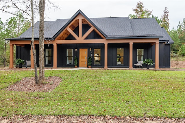1008 Folly Run Dr, Lincolnton, GA 30817 - view of front of home with board and batten siding, roof with shingles, and a front lawn