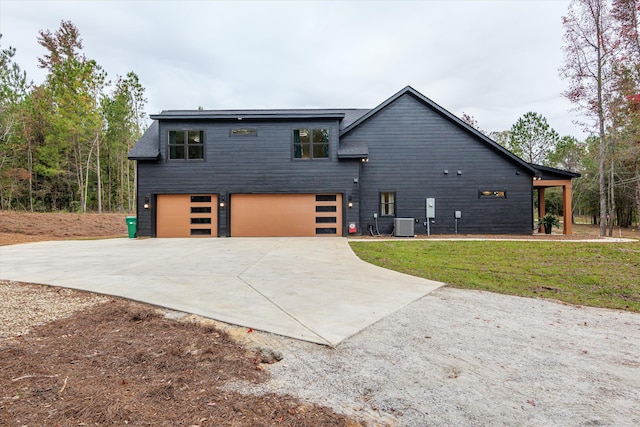 1008 Folly Run Dr, Lincolnton, GA 30817 - view of front facade with concrete driveway, a garage, and a front lawn