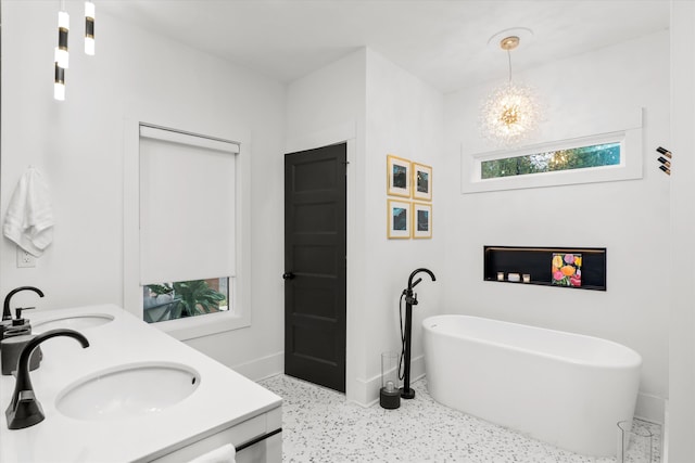 1008 Folly Run Dr, Lincolnton, GA 30817 - full bath featuring speckle patterned floor, a soaking tub, a chandelier, and double vanity