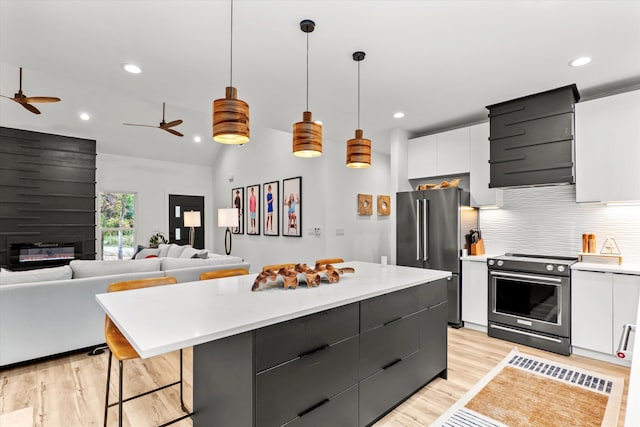 1008 Folly Run Dr, Lincolnton, GA 30817 - kitchen with appliances with stainless steel finishes, modern cabinets, light wood finished floors, white cabinetry, and recessed lighting