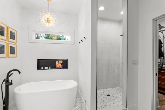 1008 Folly Run Dr, Lincolnton, GA 30817 - full bath featuring a soaking tub, a chandelier, tiled shower, and recessed lighting