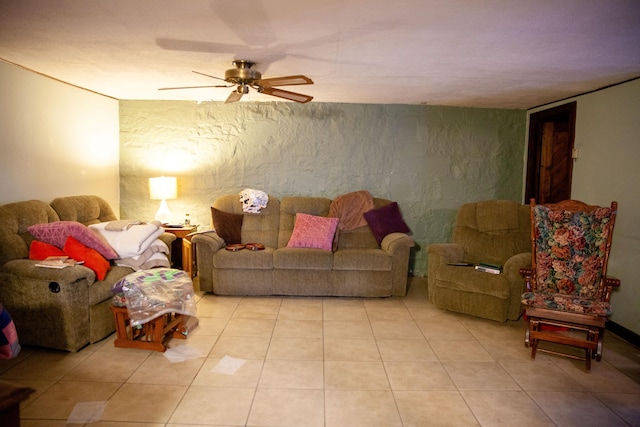 living room with ceiling fan and light tile patterned floors